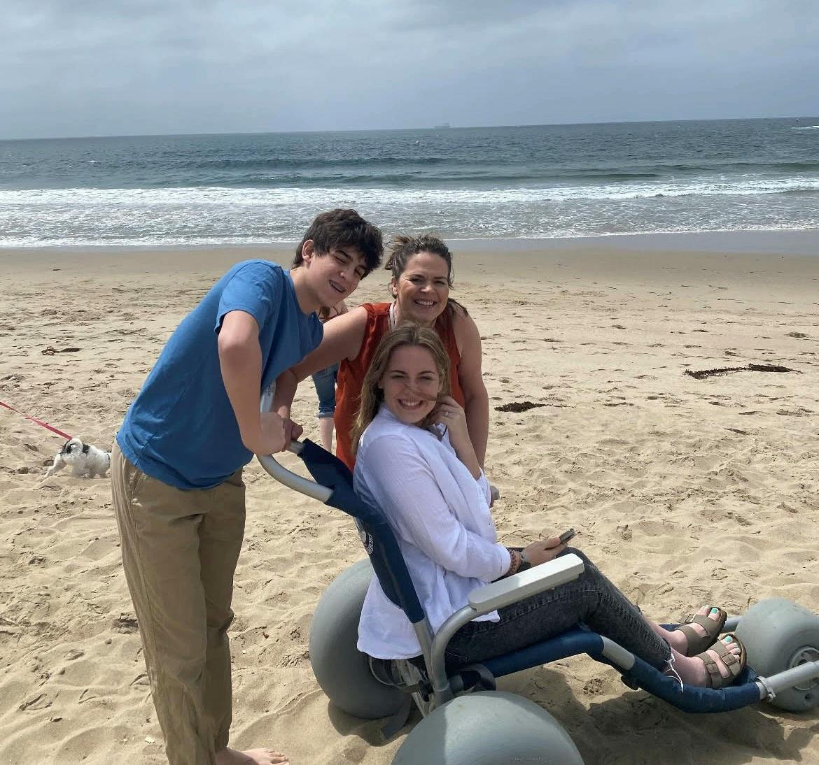 Julianna with her mom and brother at the beach.